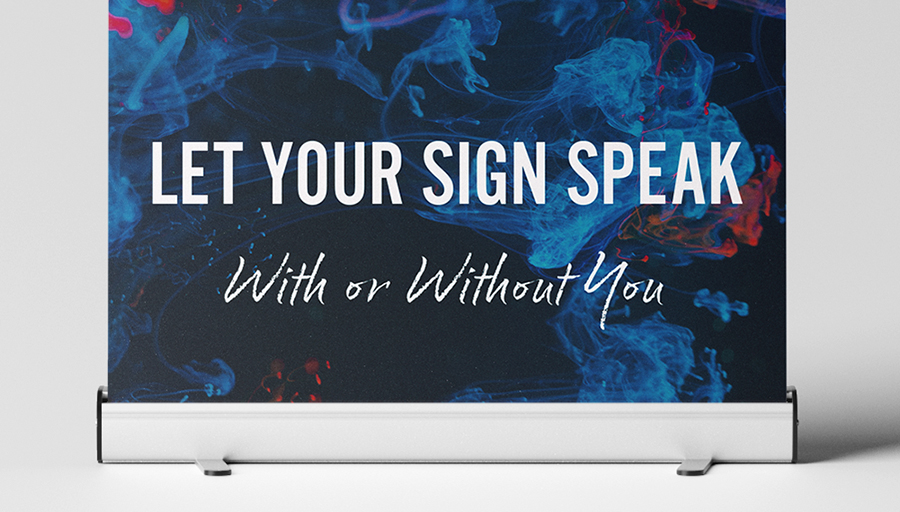 Retractable banner with message, "Let Your Sign Speak, With or Without You"